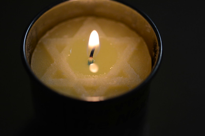 A lit memorial candle