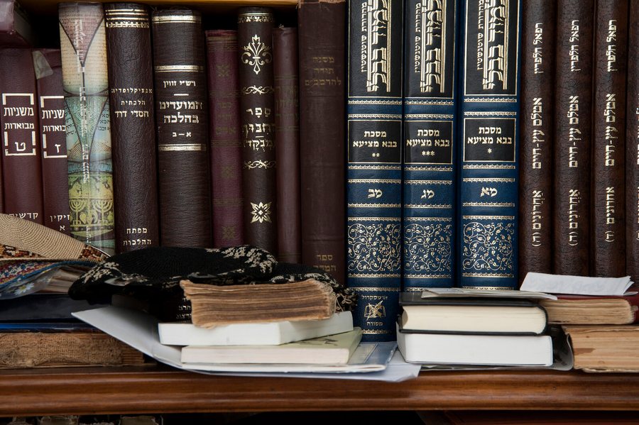 A shelf of Hebrew study volumes